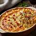 Gratin de Pâtes aux Fromages Forts et Lardons sortant du four